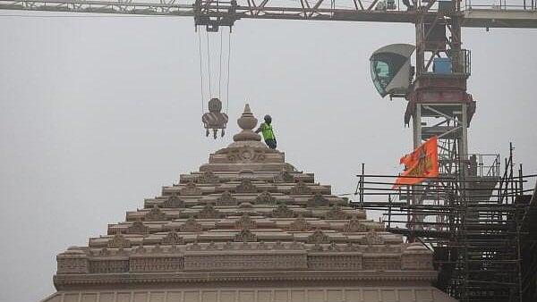<div class="paragraphs"><p>A worker stands on a stone structure being carved at the under construction site of the Ram Temple in Ayodhya.</p></div>