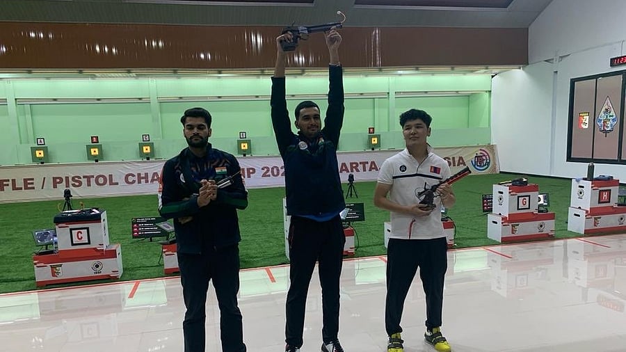 <div class="paragraphs"><p>Varun Tomar (C) scored 239.6 points to win Olympic Quota and Gold medal for India in 10m Air Pistol Men event at Asian Qlympic Qualification. </p></div>
