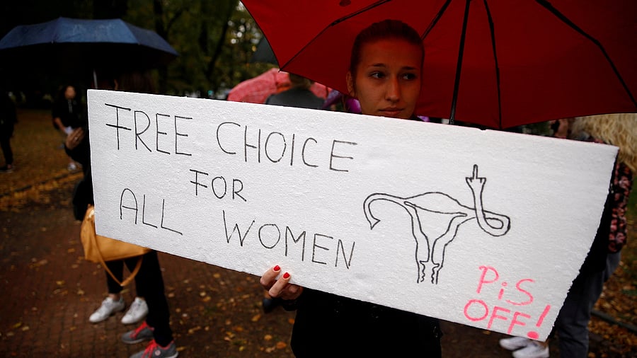 <div class="paragraphs"><p>A woman holds a placard in an abortion rights campaigners' demonstration.</p></div>
