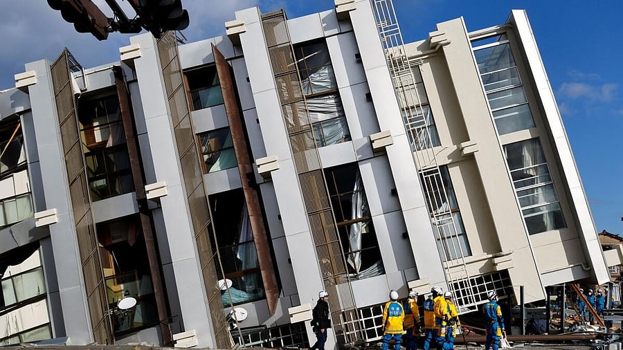 <div class="paragraphs"><p>Police officers inspect a collapsed building, in the aftermath of an earthquake, in Wajima, Ishikawa Prefecture, Japan.</p></div>
