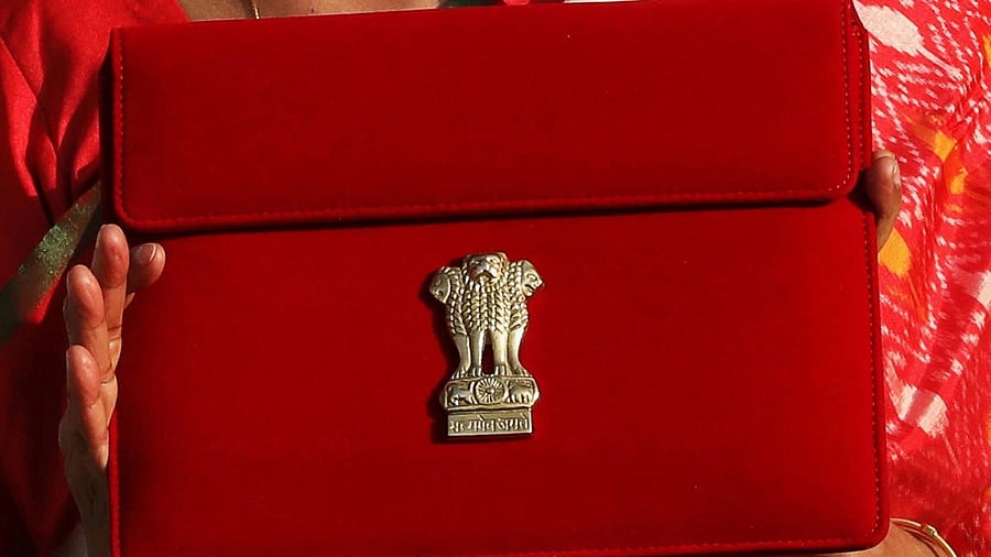<div class="paragraphs"><p>Finance Minister Nirmala Sitharaman holds up a folder with the Government of India logo, as she leaves her office to present the federal budget in the parliament in New Delhi, India, February 1, 2021.</p></div>