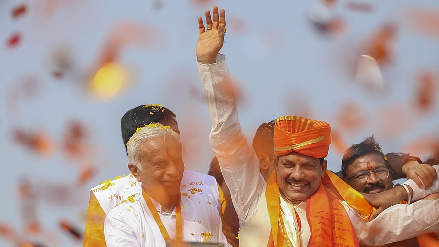 <div class="paragraphs"><p>Madhya Pradesh Chief Minister Mohan Yadav waves during a roadshow in Khargone.</p></div>