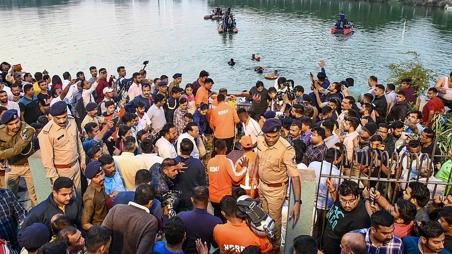 <div class="paragraphs"><p>People gather during a rescue and search operation after a boat overturned in a lake, in Vadodara, Thursday, Jan. 18, 2024.</p></div>