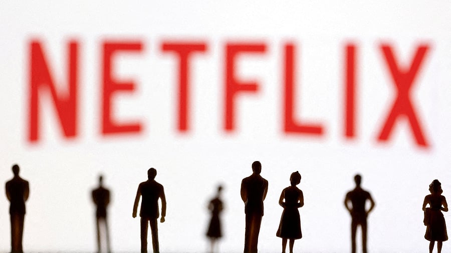 <div class="paragraphs"><p>Toy figures of people are seen in front of the displayed Netflix logo.</p></div>