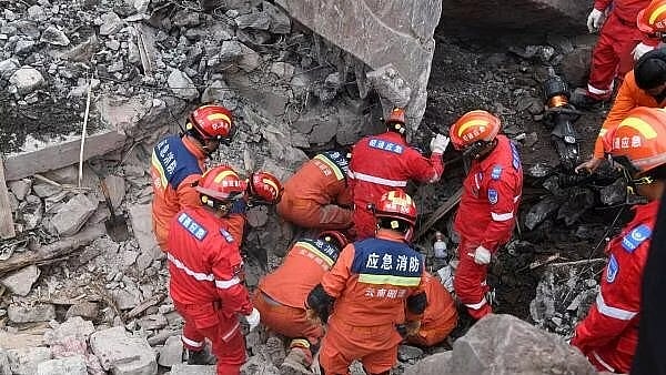 <div class="paragraphs"><p>Rescue workers search for survivors in the debris after a landslide hit Zhenxiong County, in Zhaotong, Yunnan province, China.</p></div>