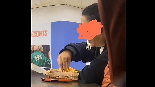 <div class="paragraphs"><p>Screengrab of video showing the woman eating rice with hands.&nbsp;</p></div>