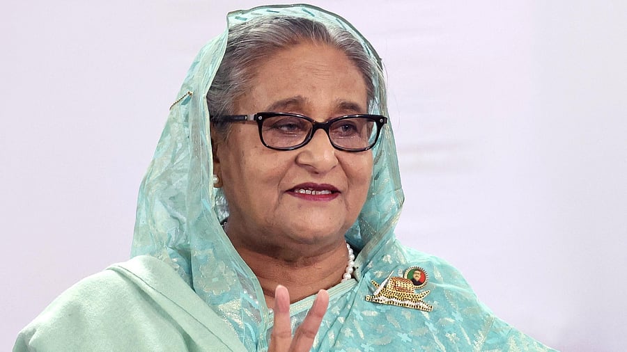 <div class="paragraphs"><p>Sheikh Hasina, Prime Minister of Bangladesh and Chairperson of Bangladesh Awami League, shows a victory sign while speaking to the press after casting her vote at the Dhaka City College center during the 12th general election in Dhaka, Bangladesh, January 7, 2024. </p></div>