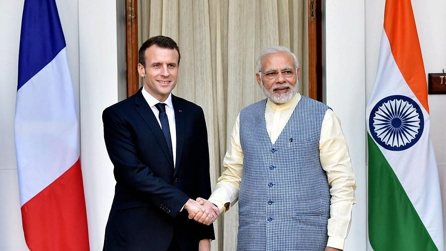<div class="paragraphs"><p>Prime Minister Narendra Modi shakes hands with French President Emmanuel Macron</p></div>