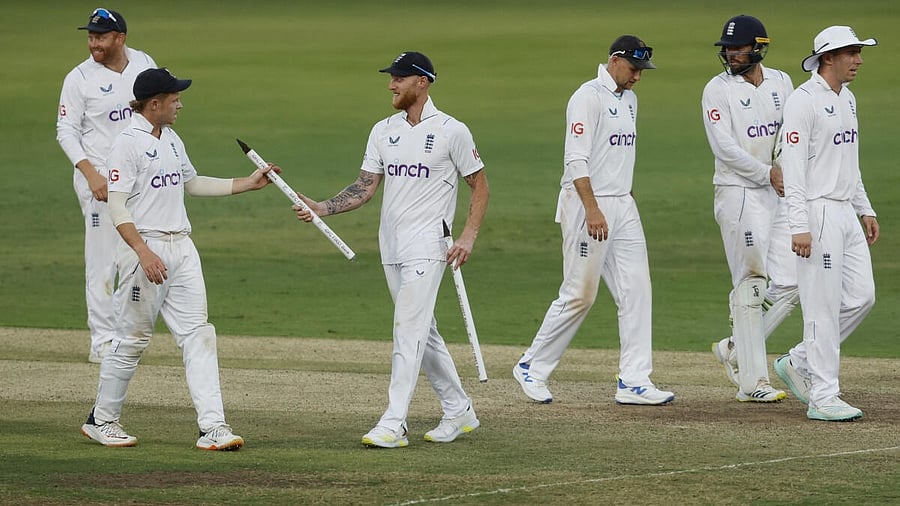 <div class="paragraphs"><p>England's Ben Stokes celebrates with Ollie Pope and teammates after winning the first Test match.</p></div>