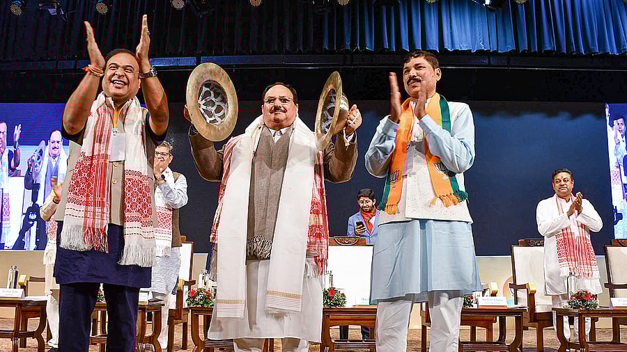<div class="paragraphs"><p>BJP National President JP Nadda play 'Taal, an Assamese instrument, during the party's Assam Pradesh Executive Meeting, in Guwahati, Wednesday, Jan. 10, 2024. Assam Chief Minister Himanta Biswa Sarma and state BJP President Bhabesh Kalita are also seen. </p></div>