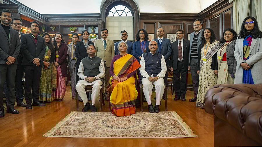 <div class="paragraphs"><p>Union Finance Minister Nirmala Sitharaman with Ministers of State Pankaj Chaudhary and Bhagwat Karad and her team of officials a day before presentation of the Interim Budget 2024, at her North Block office in New Delhi, Wednesday, January 31, 2024. </p></div>