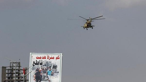 <div class="paragraphs"><p>A Houthi-operated helicpoter flies, as Houthi supporters rally to commemorate ten Houthi fighters killed by the US Navy in the Red Sea, in Sanaa, Yemen January 5, 2024.</p></div>