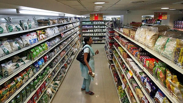 <div class="paragraphs"><p>A customer looks at consumable goods before buying them at a supermarket.</p></div>