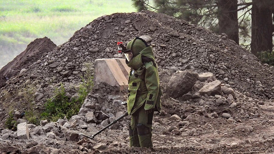 <div class="paragraphs"><p>File photo of security personnel searching for IEDs and detonators in Rajouri. (Representative image)</p></div>