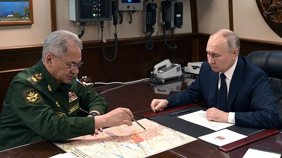 <div class="paragraphs"><p>Russia's President Vladimir Putin listens to Defence Minister Sergei Shoigu during a meeting.</p></div>