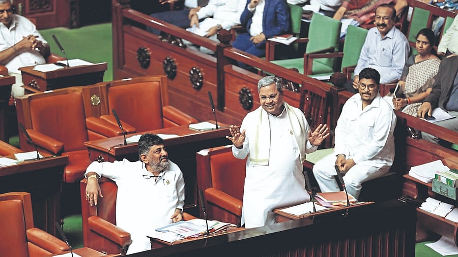 Chief Minister Siddaramaiah makes a point in the Legislative Assembly on Tuesday. Deputy Chief Minister D K Shivakumar is also seen.
