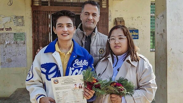 <div class="paragraphs"><p>Anju Devi Shrestha and Suprita Gurung pose for photos after they became the first lesbian couple in South Asia to officially register their marriage, at Baddiyatal in Bardiya district, Nepal.</p></div>