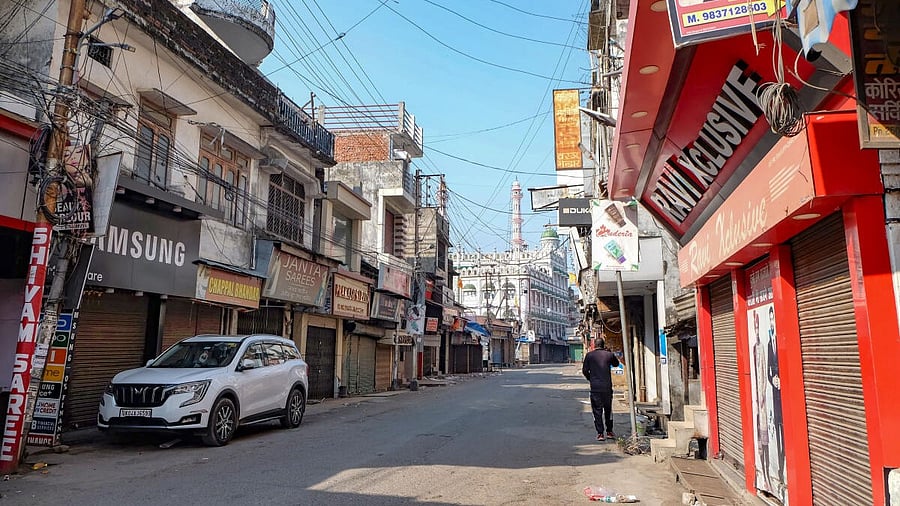<div class="paragraphs"><p>Market wears a deserted look as shops have been closed amid curfew at Banbhoolpura area that witnessed arson and vandalism by a mob over the demolition of an allegedly illegally-built madrasa on Thursday, in Haldwani</p></div>