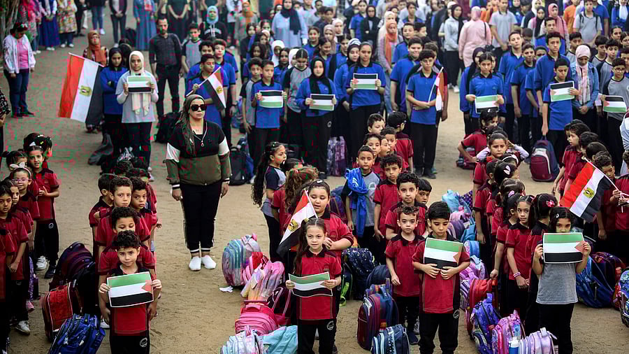 <div class="paragraphs"><p>A file photo of students standing to mourn for the Palestinian kids who were killed in Gaza.</p></div>
