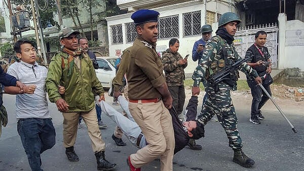 <div class="paragraphs"><p>Security personnel detain members of TIPRA Motha student organizations during their protest demanding to instate Roman script for Kokborak language along with Bengali in Tripura Board of Secondary examination, in Agartala, Monday, February 12, 2024.</p></div>