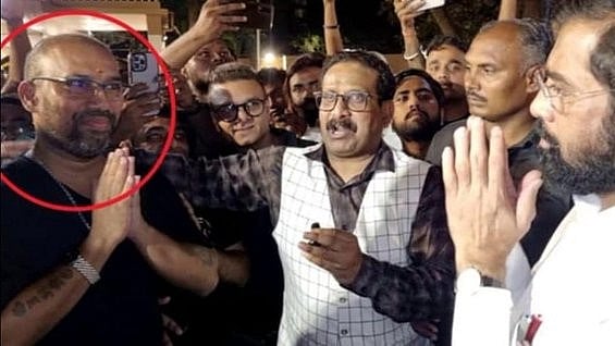 <div class="paragraphs"><p>Eknath Shinde with the accused who shot Shiv Sena (UBT) leader Abhishek Ghosalkar. (DH has not independently verified the authenticity of the photo shared by Raut.)</p></div>