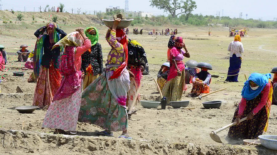 <div class="paragraphs"><p>A file photo of women labourers under Mahatma Gandhi National Rural Employment Guarantee Act (MNREGA) work at a site during on the outskirts of Rajasthan's Beawar, in 2020.</p></div>