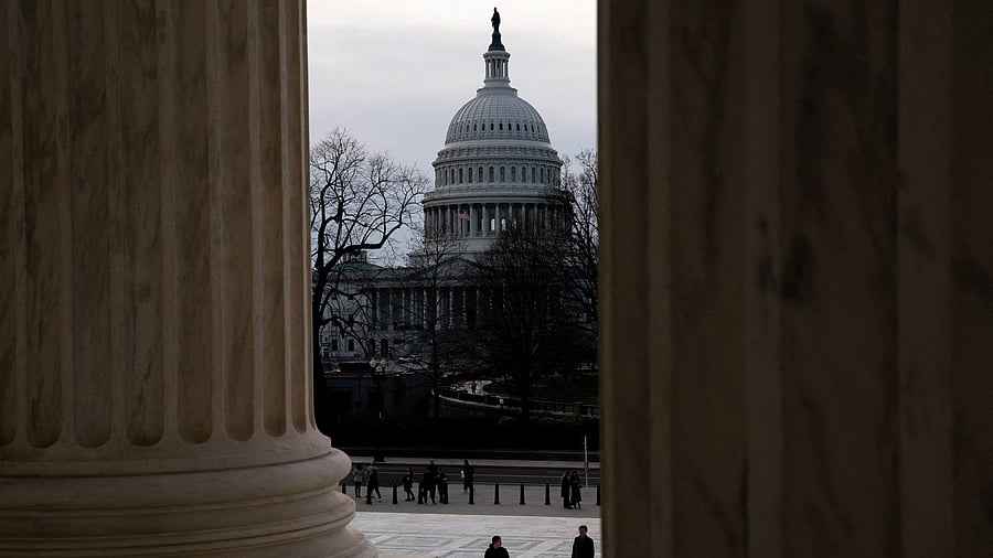 <div class="paragraphs"><p>A file photo of tourists walk near the US Capitol</p></div>