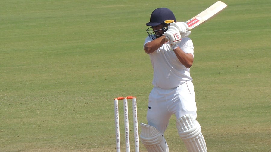 <div class="paragraphs"><p>Vidarbha's Karun Nair cuts one to during his 90-run knock against his former team Karnataka at the VCA Stadium in Nagpur on Saturday.</p></div>