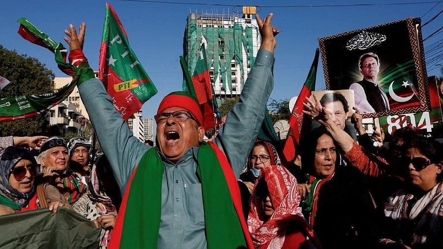 <div class="paragraphs"><p>Supporters of former Prime Minister Imran Khan's party, the Pakistan Tehreek-e-Insaf (PTI), chant slogans as they gather during a protest demanding free and fair results of the elections in Karachi. </p></div>