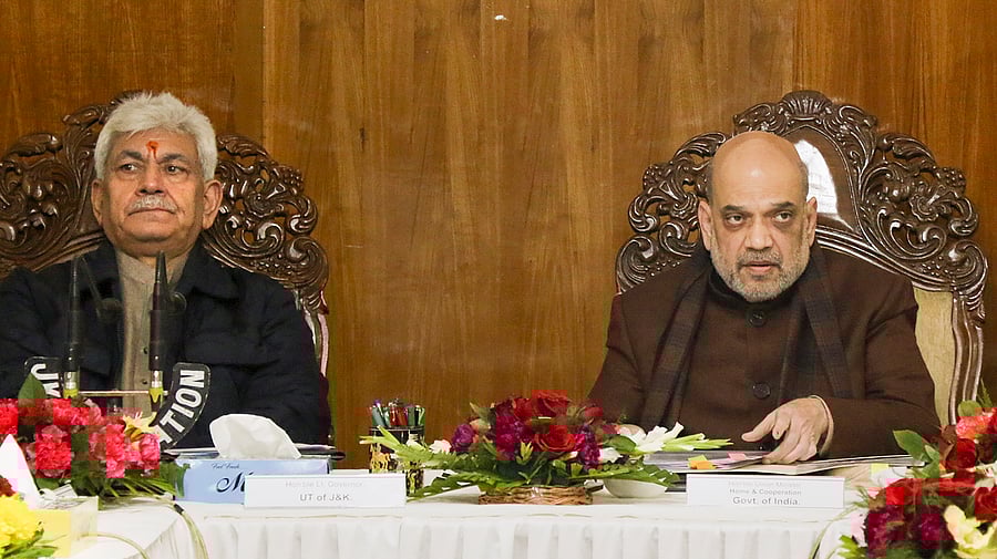 <div class="paragraphs"><p>A file photo of Union Home Minister Amit Shah with Jammu and Kashmir Lieutenant Governor Manoj Sinha.&nbsp;</p></div>