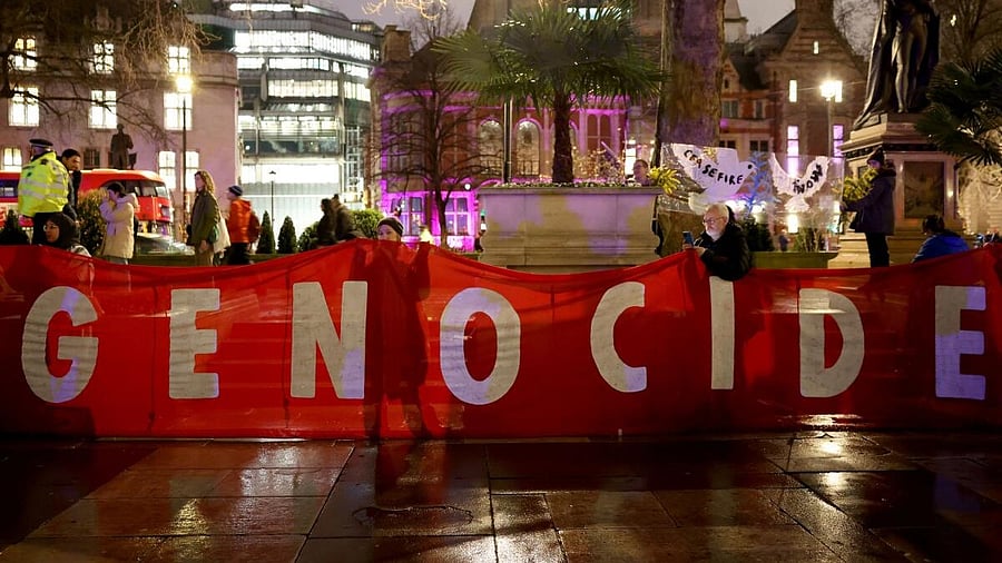 <div class="paragraphs"><p>People demonstrate calling for an immediate ceasefire in Gaza.</p></div>