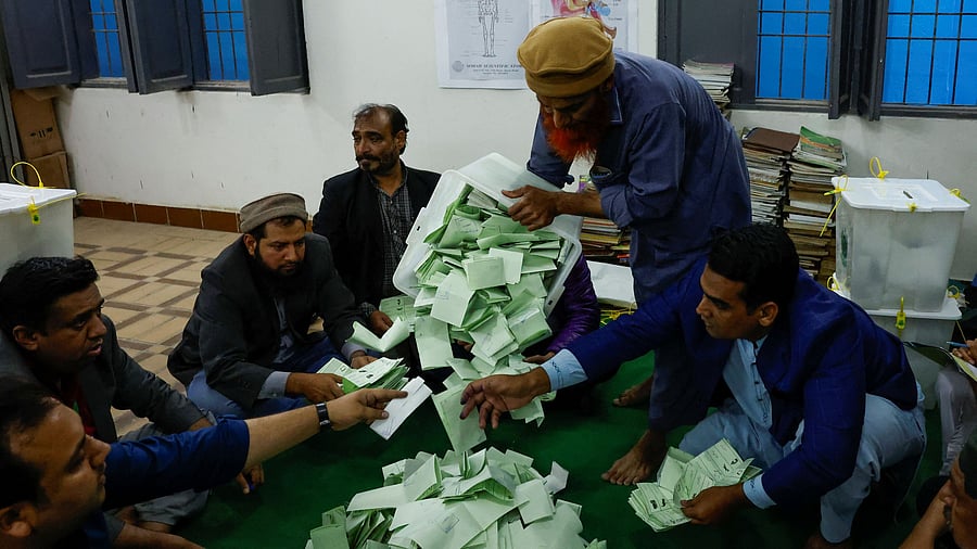 <div class="paragraphs"><p>File Photo: Polling officers count ballot papers during the general election in Karachi, Pakistan.</p></div>