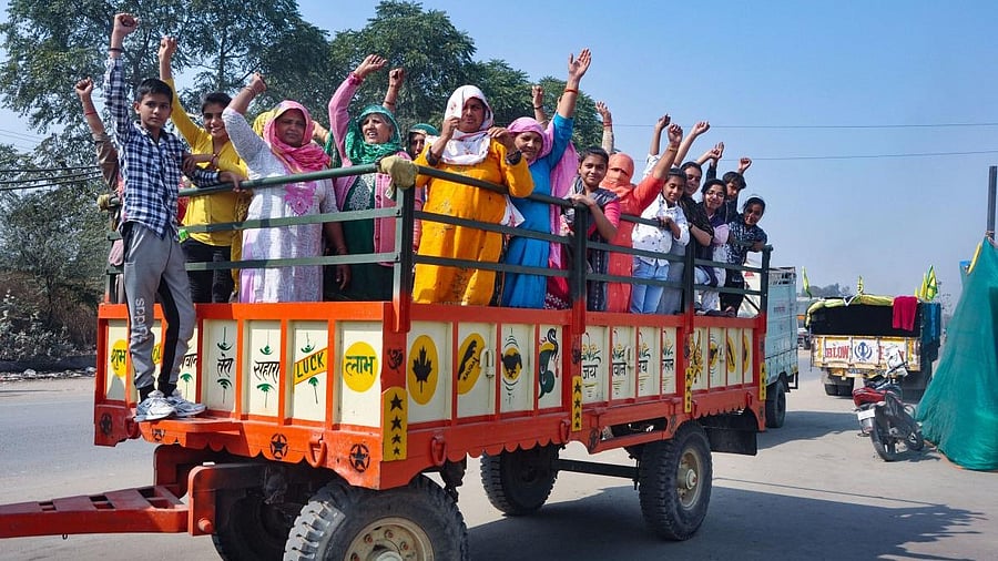<div class="paragraphs"><p>Women and children ride a tractor on their way to take part in farmers' protest against farm reform laws at Singhu border, in Sonipat district.</p></div>