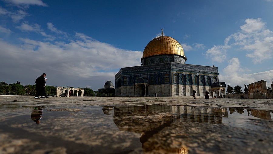 <div class="paragraphs"><p>Palestinians walk in front of the Dome of the Rock on Al-Aqsa. Image for reprsentation</p></div>