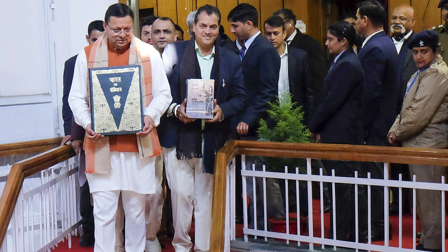<div class="paragraphs"><p>Uttarakhand Chief Minister Pushkar Singh Dhami with others holds a copy of the Constitution of India, at Vidhan Sabha Bhawan, in Dehradun.</p></div>