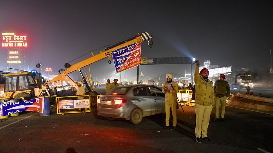 <div class="paragraphs"><p>Police personnel stand guard during traffic restrictions near Shambhu Border ahead of the scheduled march by the protesting farmers towards Delhi.</p></div>
