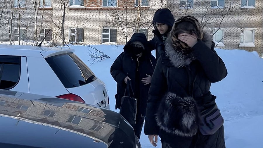 <div class="paragraphs"><p>A woman  wearing a protective mask and sunglasses, believed to be Lyudmila Navalnaya, the mother of Russian opposition leader Alexei Navalny, is accompanied into a car as she leaves the IK-3 penal colony, where her son served his jail term and where he died the day before, according to prison authorities, in the settlement of Kharp in the Yamal-Nenets Region, Russia February 17, 2024, in this still image taken from video. </p></div>