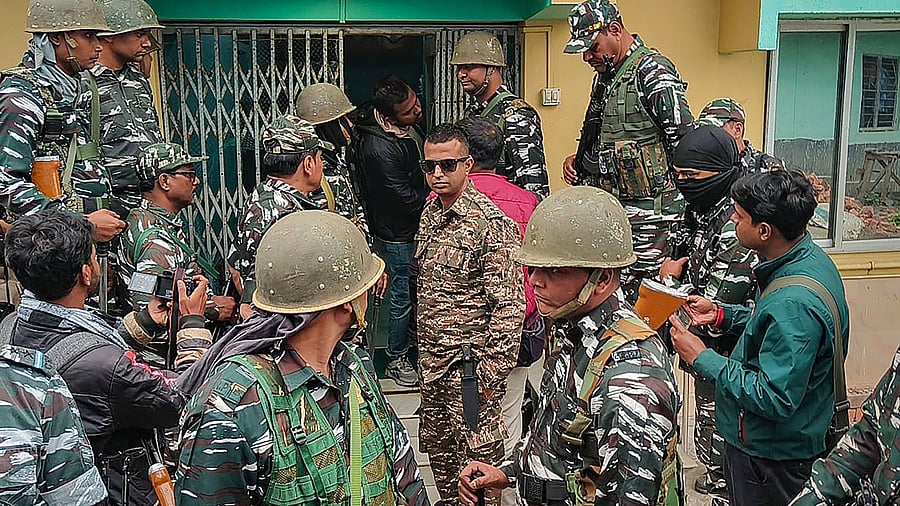 <div class="paragraphs"><p>Security personnel along with ED officers&nbsp; during a raid at TMC leader Shahjahan Sheikh's home at Sandeshkhali in North 24 Parganas district.</p></div>