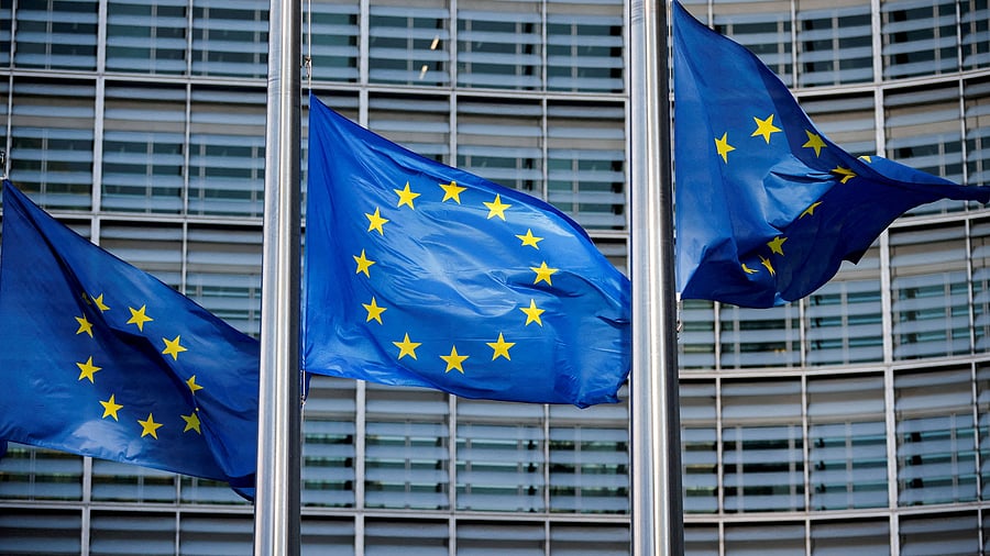 <div class="paragraphs"><p>European Union flags fly outside the European Commission headquarters in Brussels.</p></div>