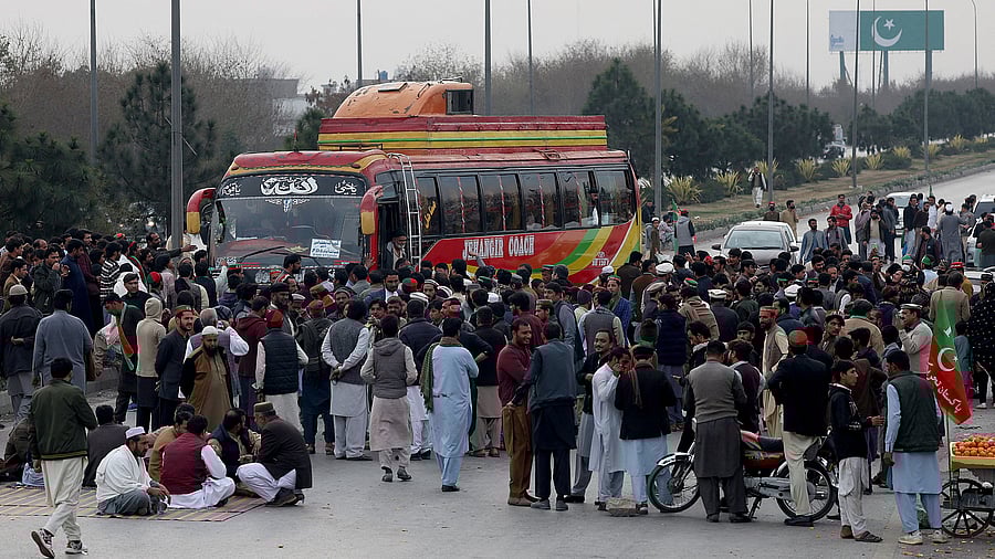 <div class="paragraphs"><p>Supporters of Pakistani former Prime Minister Imran Khan's party, the Pakistan Tehreek-e-Insaf , block the Peshawar-Islamabad motorway </p></div>
