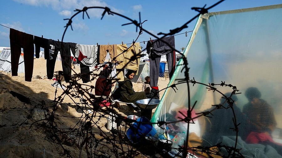 <div class="paragraphs"><p>Displaced Palestinian who fled their house due to Israeli strikes, shelter at the border with Egypt, in Rafah in the southern Gaza Strip.</p></div>