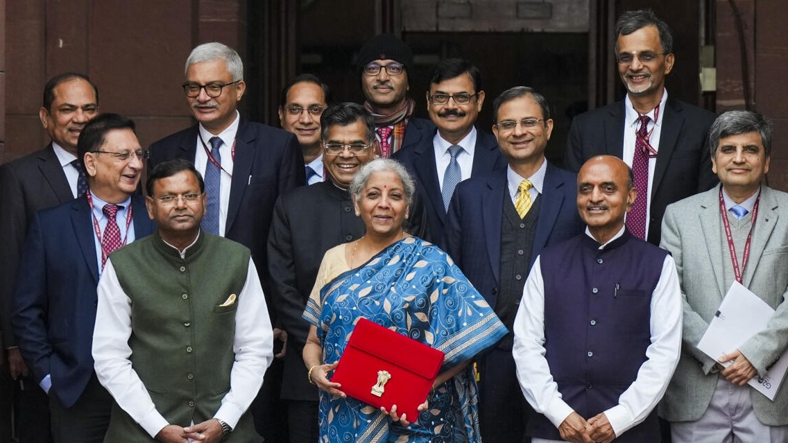 <div class="paragraphs"><p>Union Finance Minister Nirmala Sitharaman with Ministers of State Bhagwat Kishanrao Karad and Pankaj Chaudhary, and other officials poses for photos outside the Finance Ministry ahead of the presentation of Interim Budget 2024, in New Delhi,</p></div>