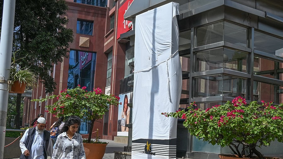 <div class="paragraphs"><p>Activists tear down English-language signs installed by stores. </p></div>