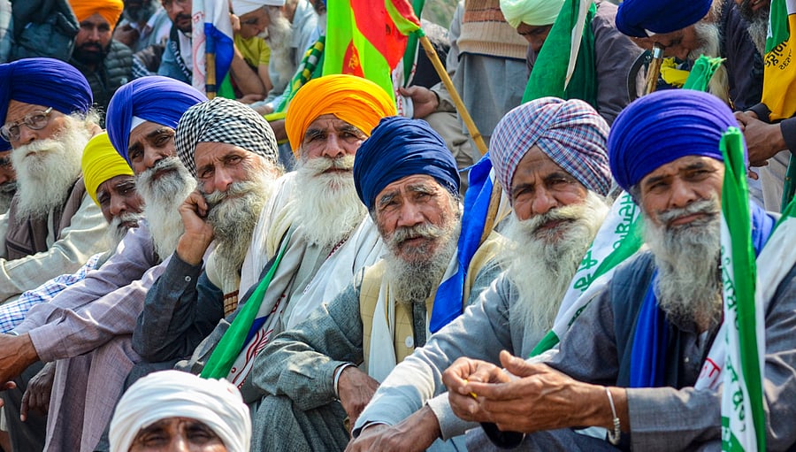 <div class="paragraphs"><p>Farmers listen to a leader (unseen) at the Punjab-Haryana Shambhu border during farmers' 'Delhi Chalo' protest, near Patiala district, Saturday, Feb. 17, 2024.</p></div>