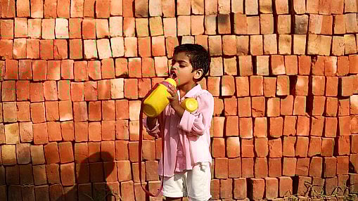 <div class="paragraphs"><p>A student drinking water.</p></div>