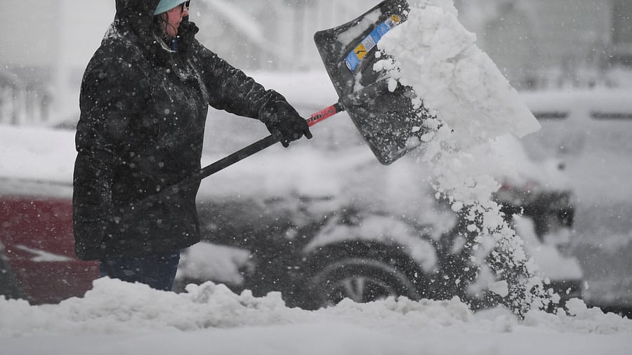 <div class="paragraphs"><p>Representative image of a woman shoveling snow.</p></div>