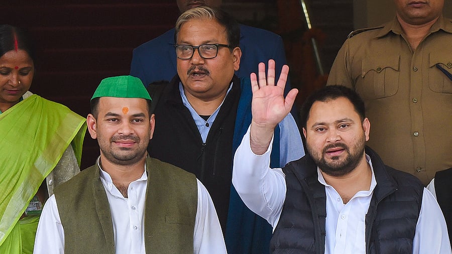 <div class="paragraphs"><p>RJD leader Tejashwi Yadav with party MLA Tej Pratap Yadav and MP Manoj Kumar Jha </p></div>