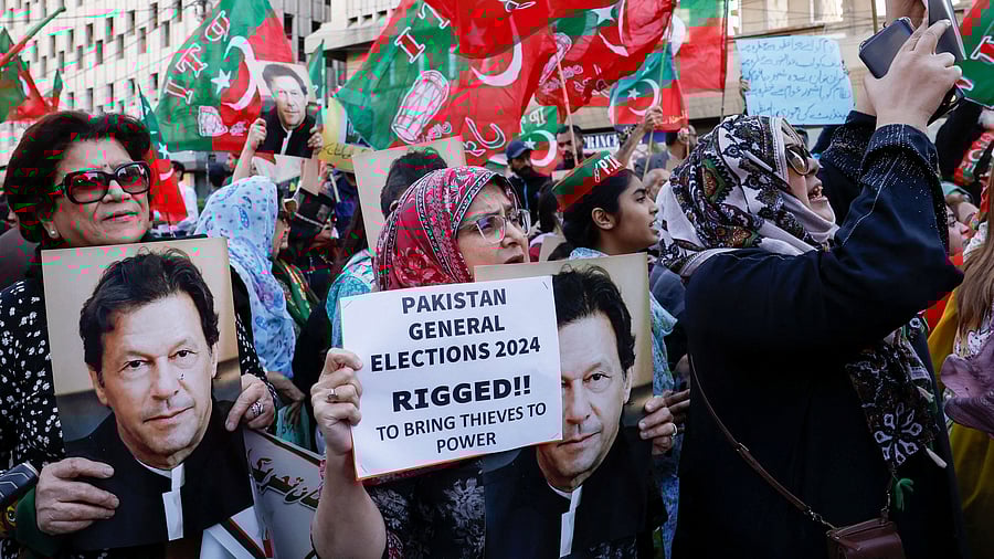 <div class="paragraphs"><p>Supporters of former Prime Minister Imran Khan's party, carry posters and placards as they chant slogans against what they call, 'blatant rigging in national election', during a protest in Pakistan.</p></div>