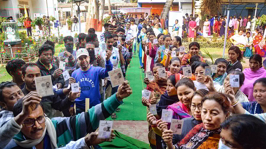 <div class="paragraphs"><p>Voters in India show their identification cards.</p></div>