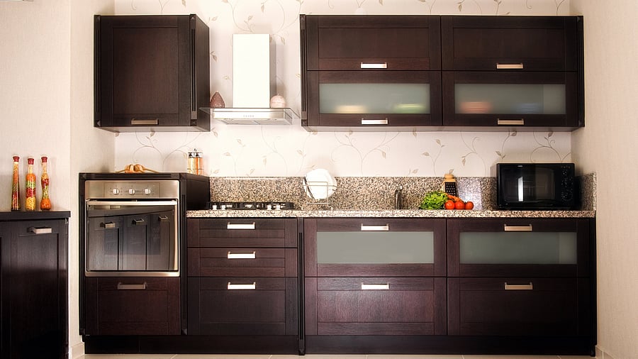 <div class="paragraphs"><p>Dark brown, grey and black cabinets hide dust and grime.&nbsp;</p></div>